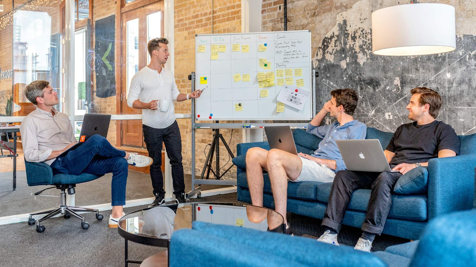 A team planning a product together at a whiteboard